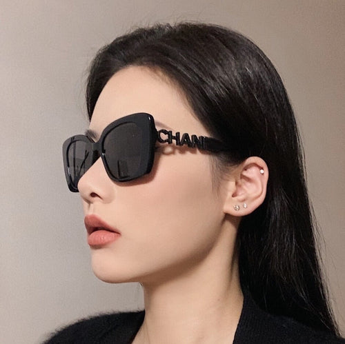 McMacfil Women's Sunglasses: Black Oversized Cat Eye Glasses with Hollow Letter Logo, UV Protection, and Handcrafted Design.